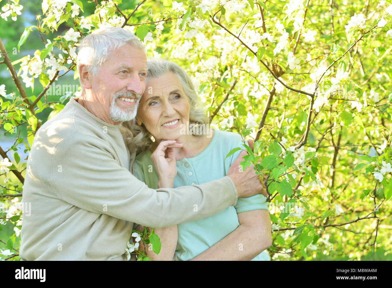 Happy couple posing in park Stock Photo - Alamy