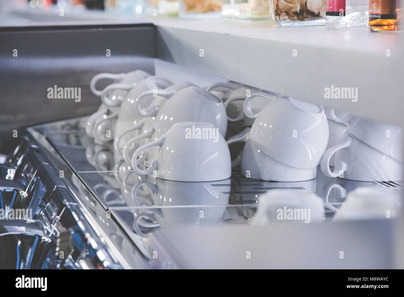 a few clean white cups for coffee in a bar Stock Photo - Alamy