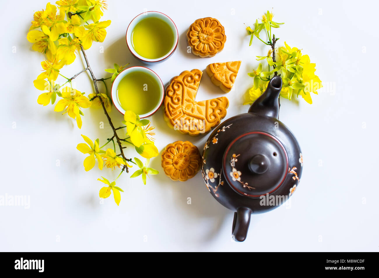 Mooncake and tea, food and drink for Chinese mid autumn festival. Isolated on white background Stock Photo