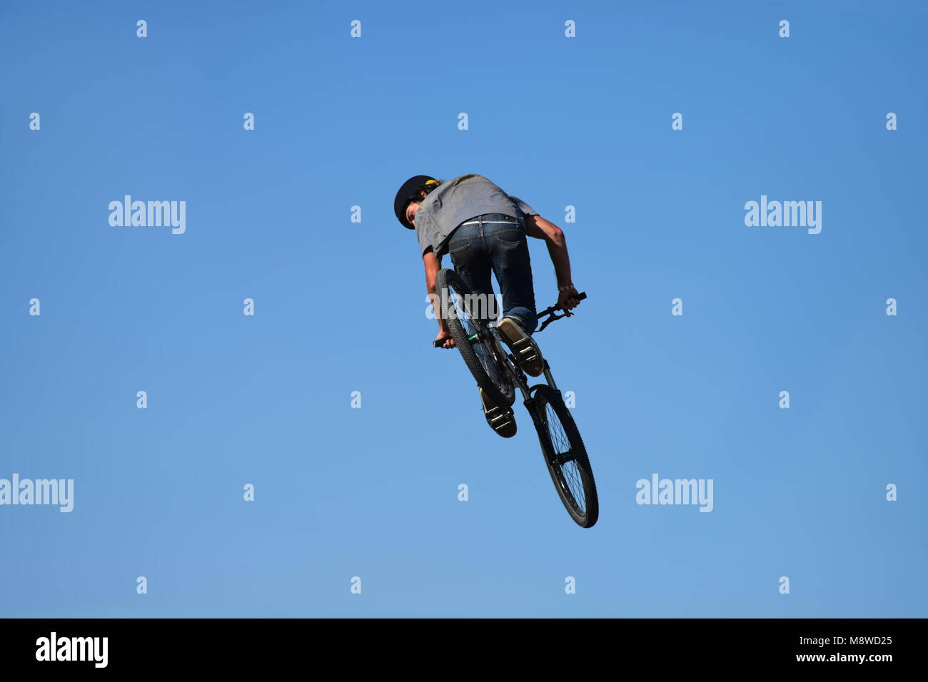 Flying with a bicycle - Cycling is a heart-powered mode of  transportation Stock Photo