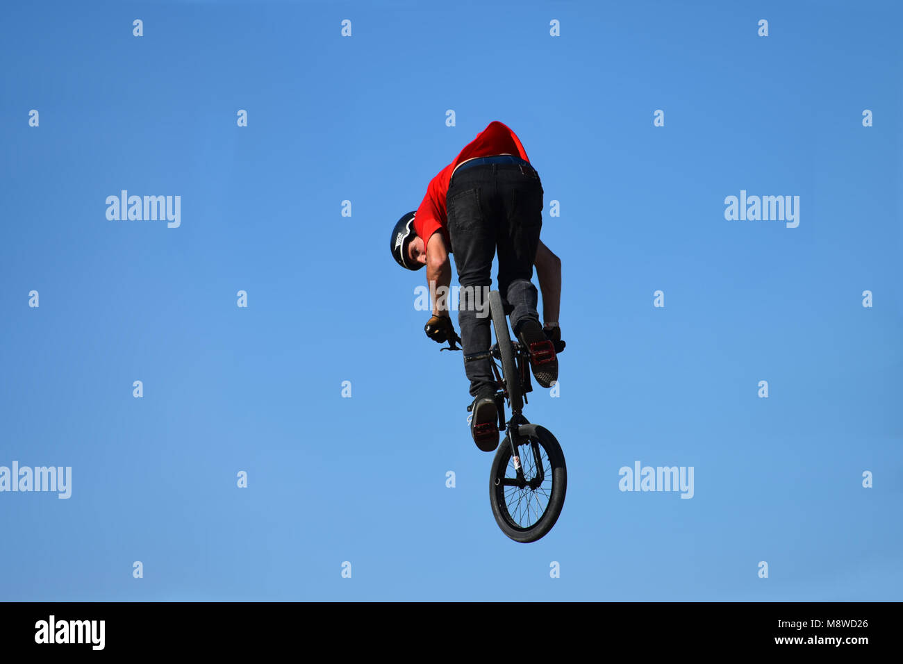 Flying with a bicycle - Cycling is a heart-powered mode of  transportation Stock Photo