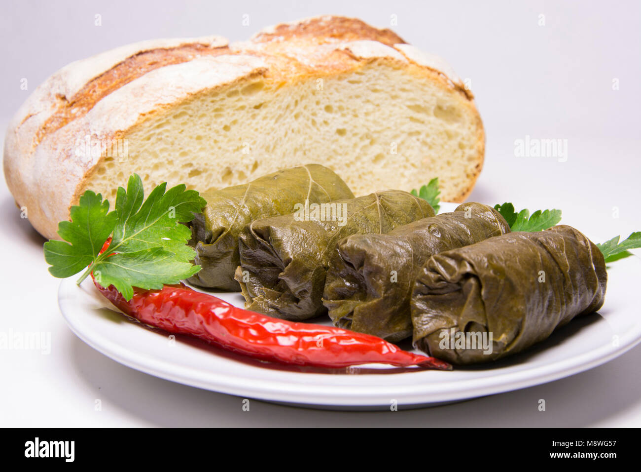 Grape leaves rolls. Sarmale, dolma, sarma, golubtsy or golabki. Grape leaves stuffed with meat, rice and vegetables. East European and Asian tradition Stock Photo