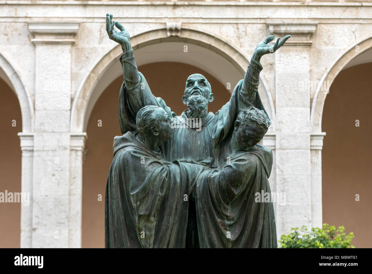 Montecassino, Italy - June 17, 2017: The entrance cloister of Monte Cassino Abbey and the death of Saint Benedict Statue. Italy Stock Photo