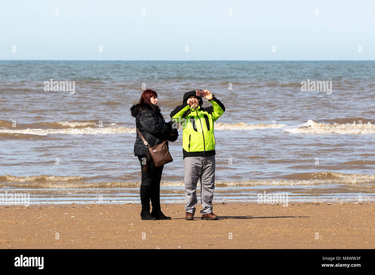 Southport, Merseyside. 20th March 2018. UK Weather.  A gorgeous sunny spring like day over the north west of England are perfect conditions for a selfie in the sun on the golden sands of Southport beach in Merseyside.  Credit: Cernan Elias/Alamy Live News Stock Photo