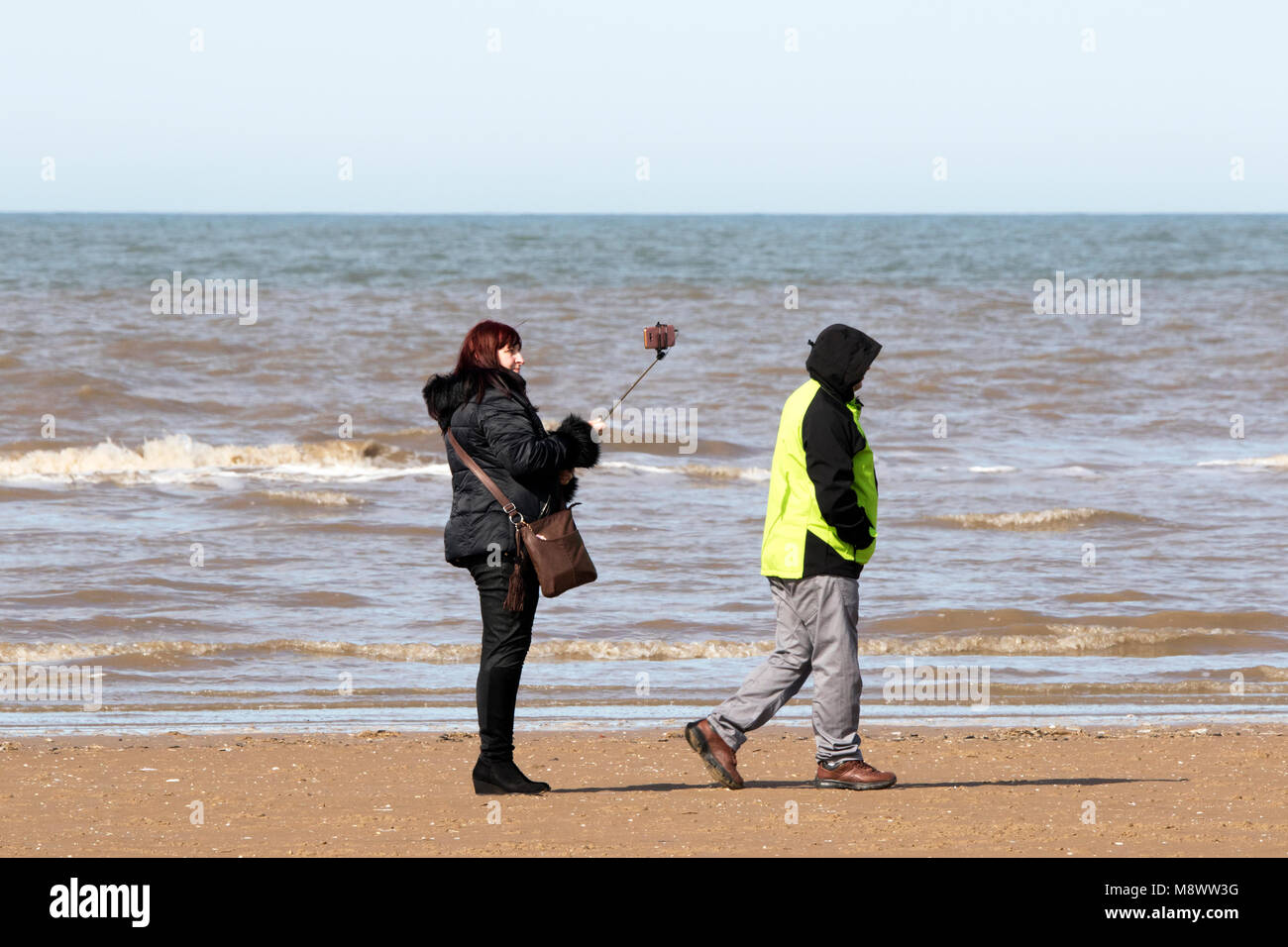 Southport, Merseyside. 20th March 2018. UK Weather.  A gorgeous sunny spring like day over the north west of England are perfect conditions for a selfie in the sun on the golden sands of Southport beach in Merseyside.  Credit: Cernan Elias/Alamy Live News Stock Photo
