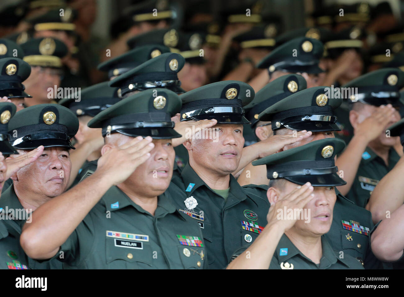 Taguig City, Philippines. 20th Mar, 2018. Military officers salute during the 121st founding anniversary of the Philippine Army in Taguig City, the Philippines, March 20, 2018. Credit: Rouelle Umali/Xinhua/Alamy Live News Stock Photo