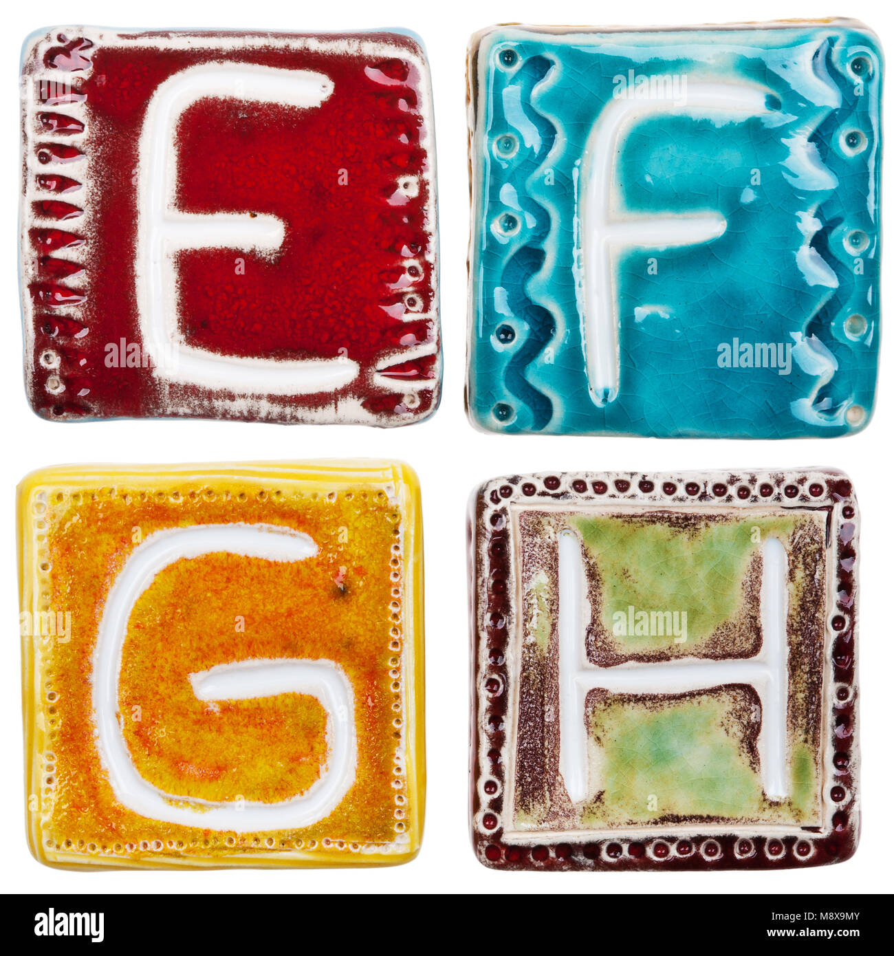 Colorful handmade ceramic letters isolated on white background Stock ...