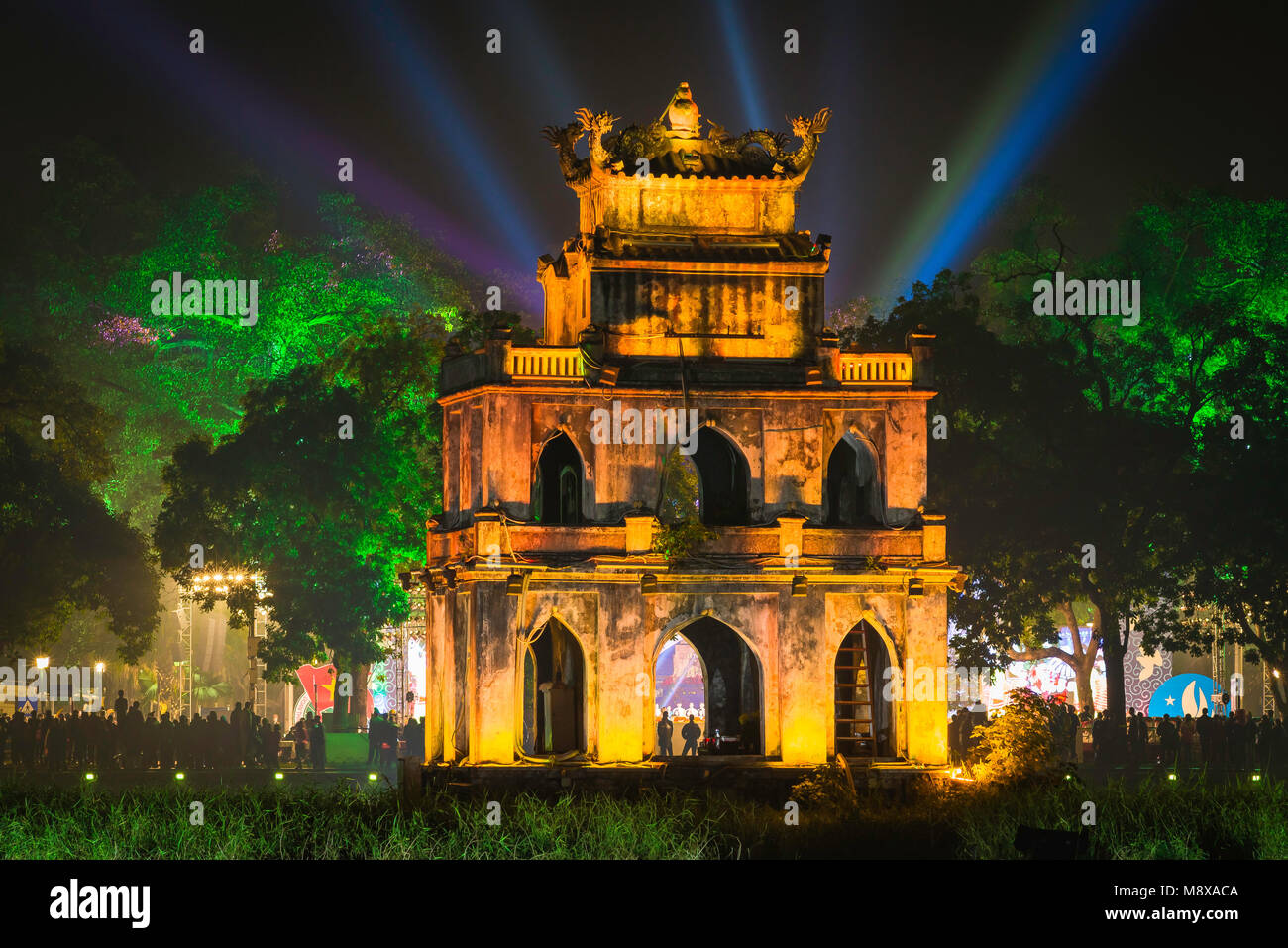 Hanoi Turtle Tower, the old pavilion known as Turtle - or Tortoise - Tower on Hoan Kiem Lake lit by floodlights to celebrate New Year's Eve, Vietnam Stock Photo