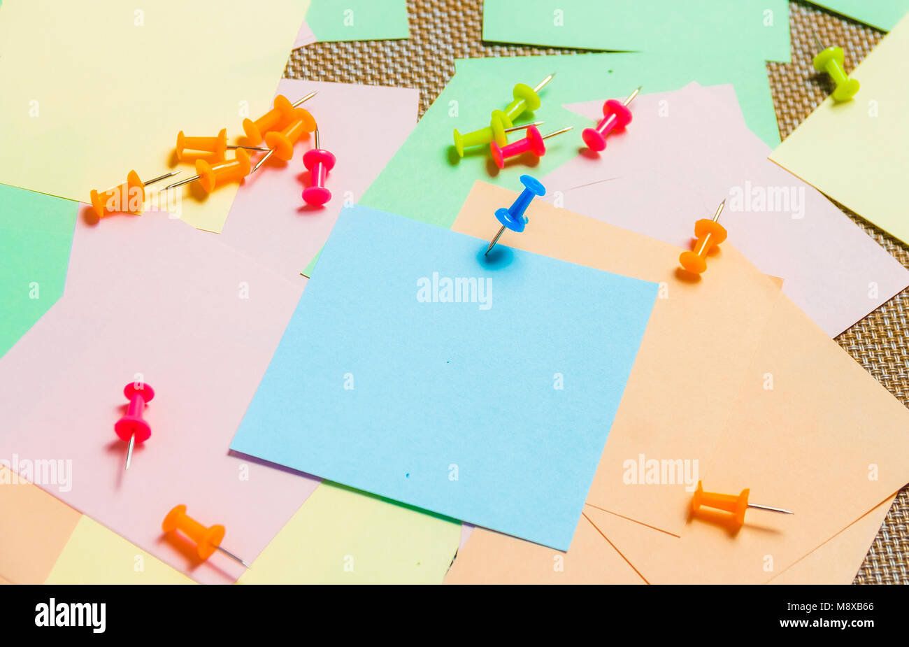Stationary, Pushpins Heap on Blank Colored Sticker. Time-management, Planning Stock Photo