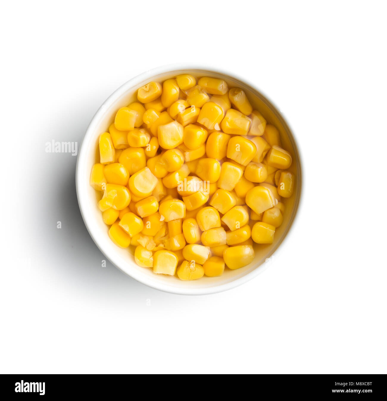 Corn seed in bowl isolated on white background Stock Photo Alamy