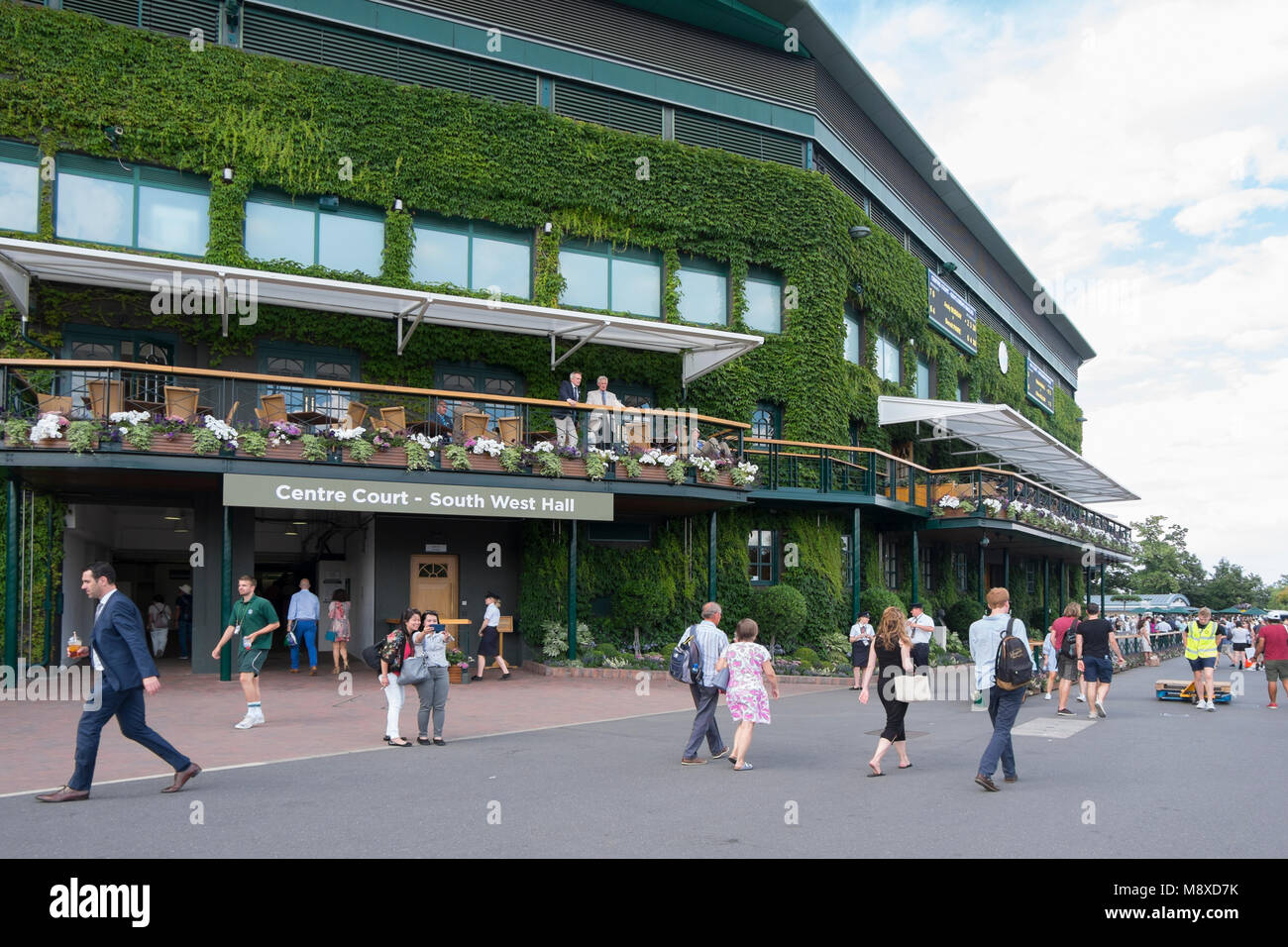 People walking around the grounds outside Centre Court at the Wimbledon tennis 2017 Championships SW19 Stock Photo