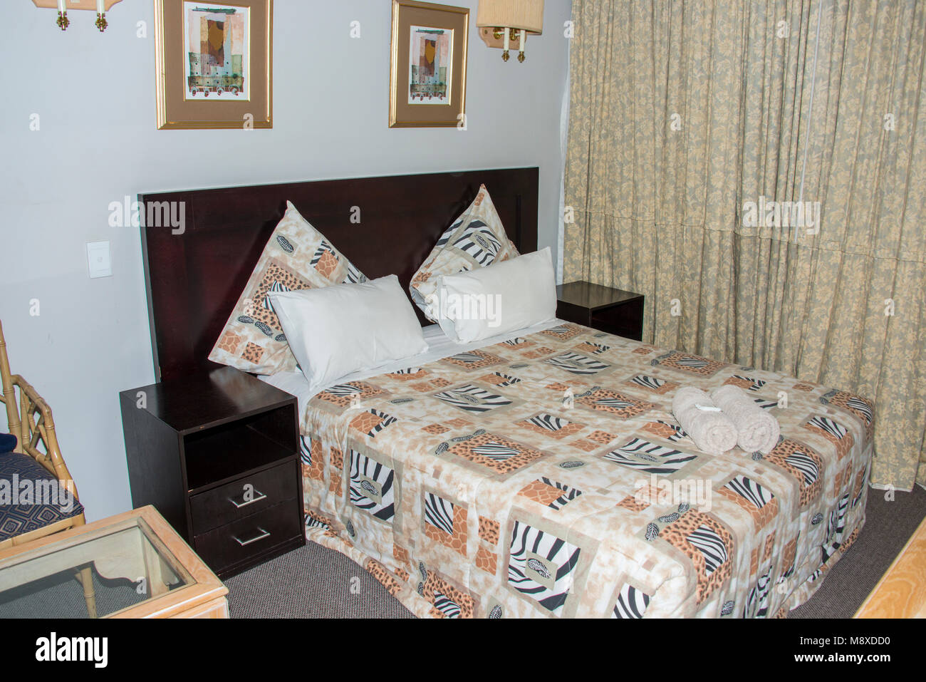 luxe hotelroom with nice curtains and towels on the bed in Johannesburg