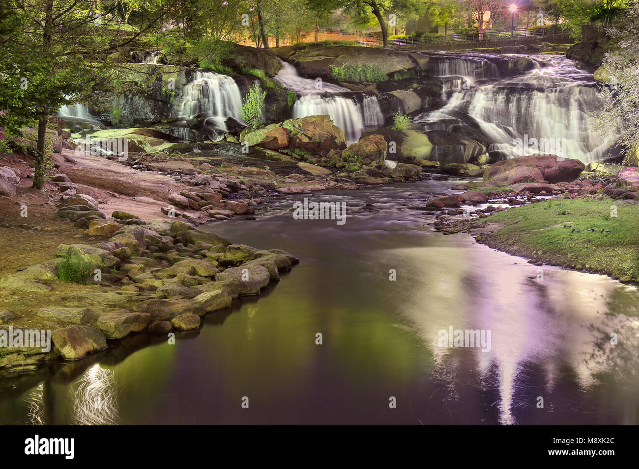 Iconic Greenville South Carolina Falls park waterfall at the heart of downtown at night Stock Photo
