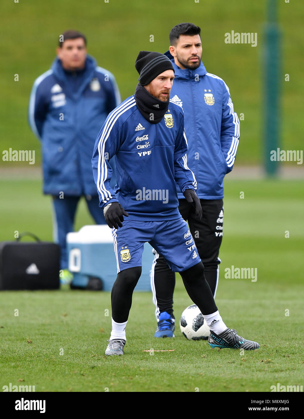 Argentina's Sergio Aguero and Lionel Messi (left) during a training session at the City football Academy, Manchester. Stock Photo