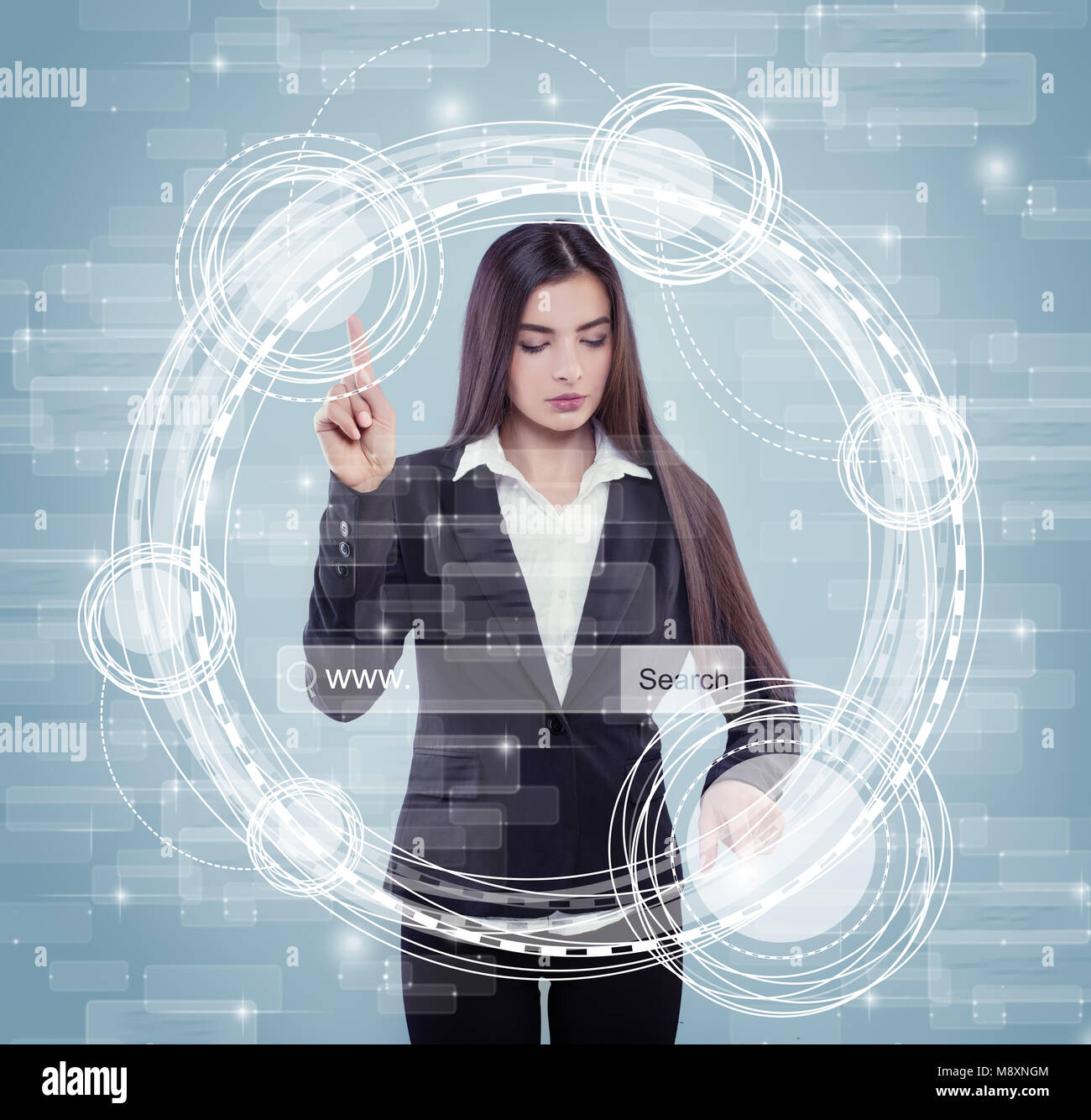 Young Woman Touching Sensitive Screen while Selecting Surface Option. Female Standing at big Virtual Display with Advanced Innovative Device and Infog Stock Photo