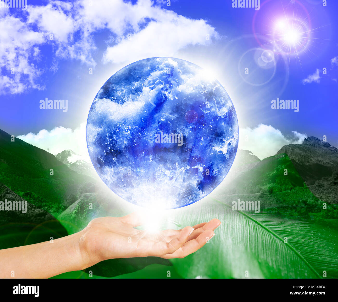 One hand holds the globe in balance Stock Photo