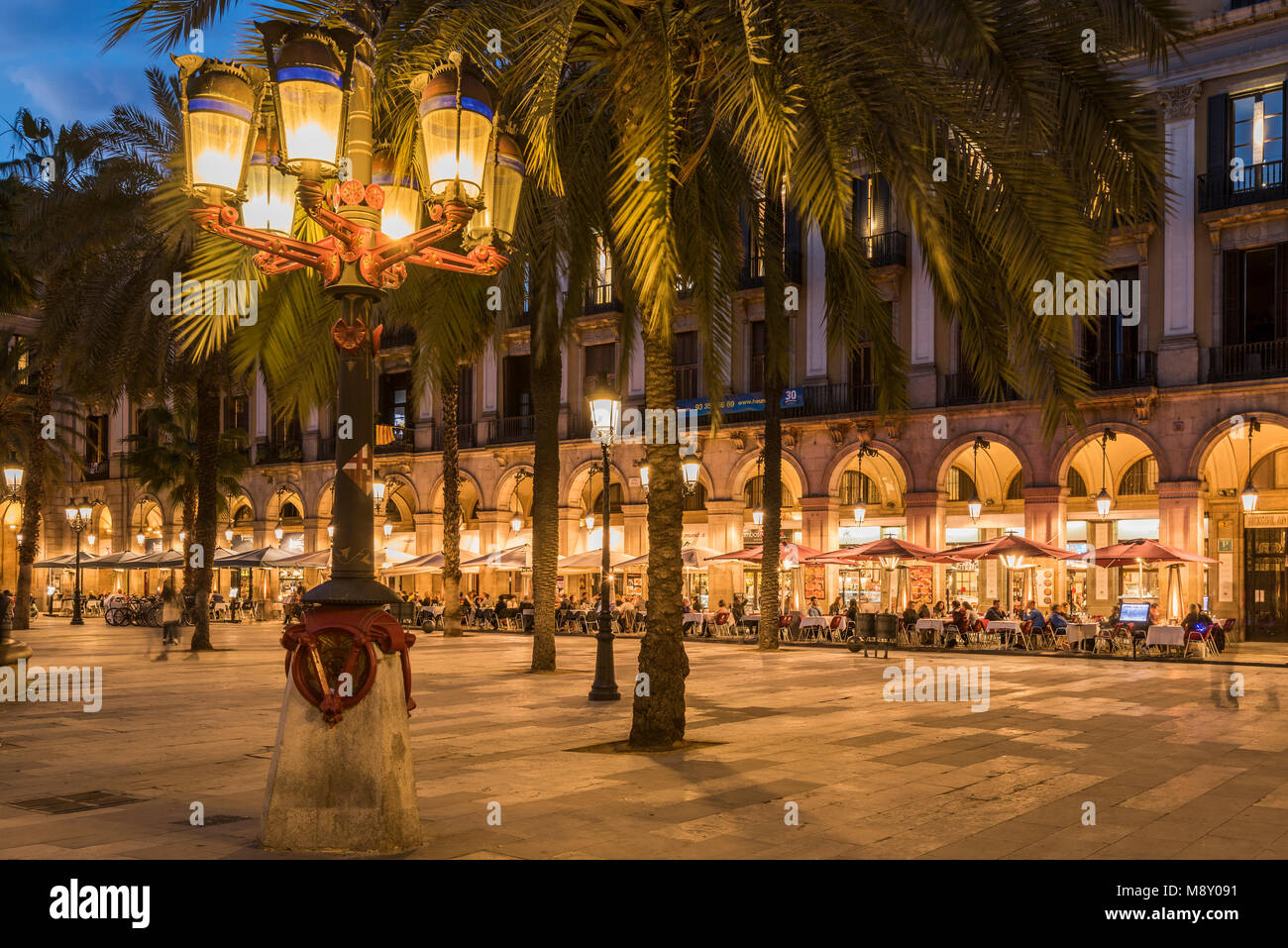 Lamp post designed by the famous Catalan architect Antoni Gaudi in Placa Reial square (Plaza Real), Gothic Quarter, Barcelona, Catalonia, Spain Stock Photo