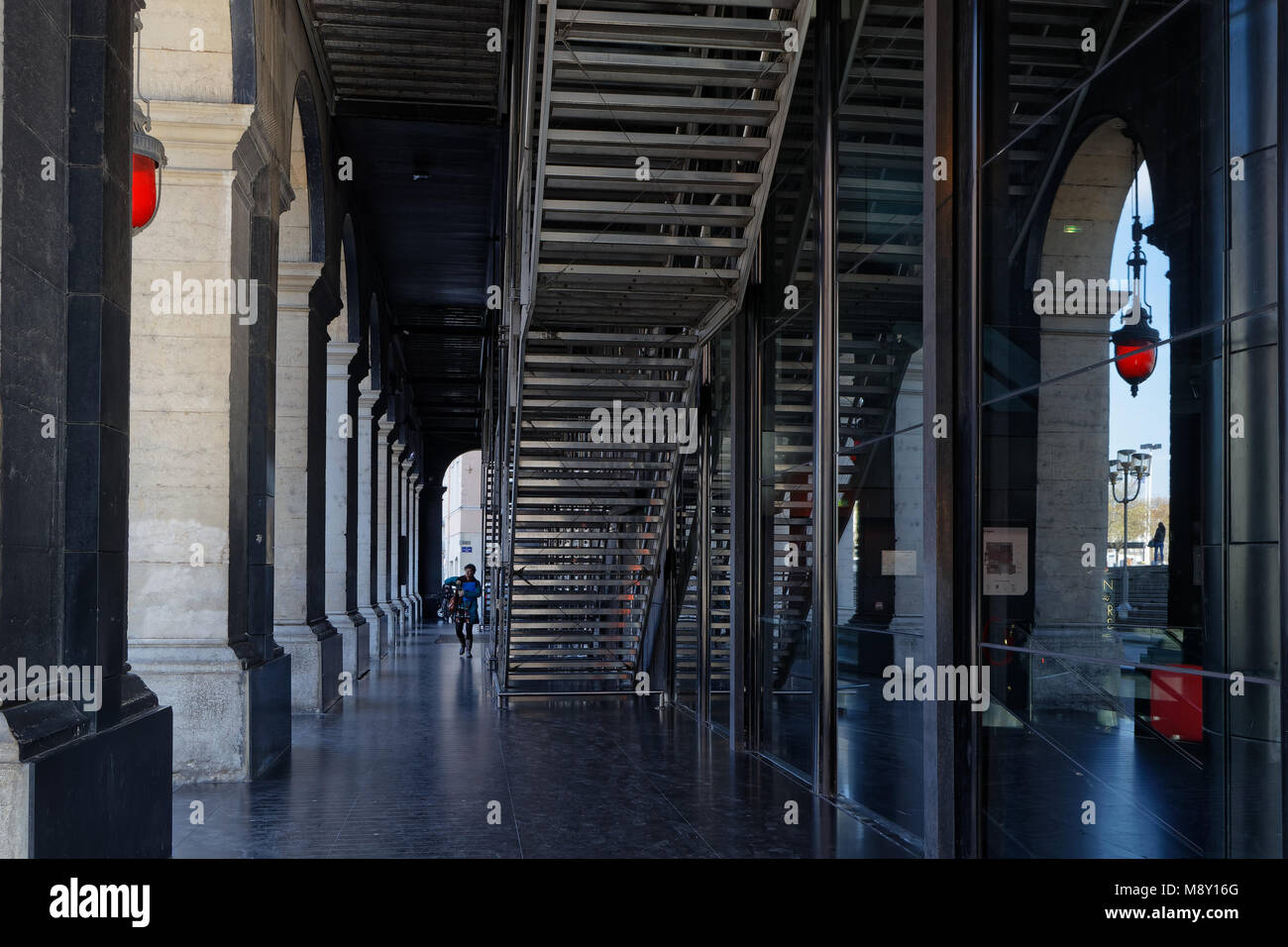 LYON, FRANCE, March 19, 2018 : Arcades under the opera house of Lyon. The original opera house was re-designed by French architect Jean Nouvel between Stock Photo