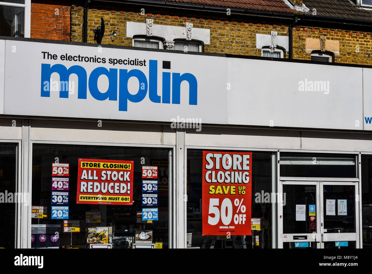 Maplin the electronics specialist store shop, in administration. Closing down sale notices. All stock reduced. Shop front with sale signs Stock Photo