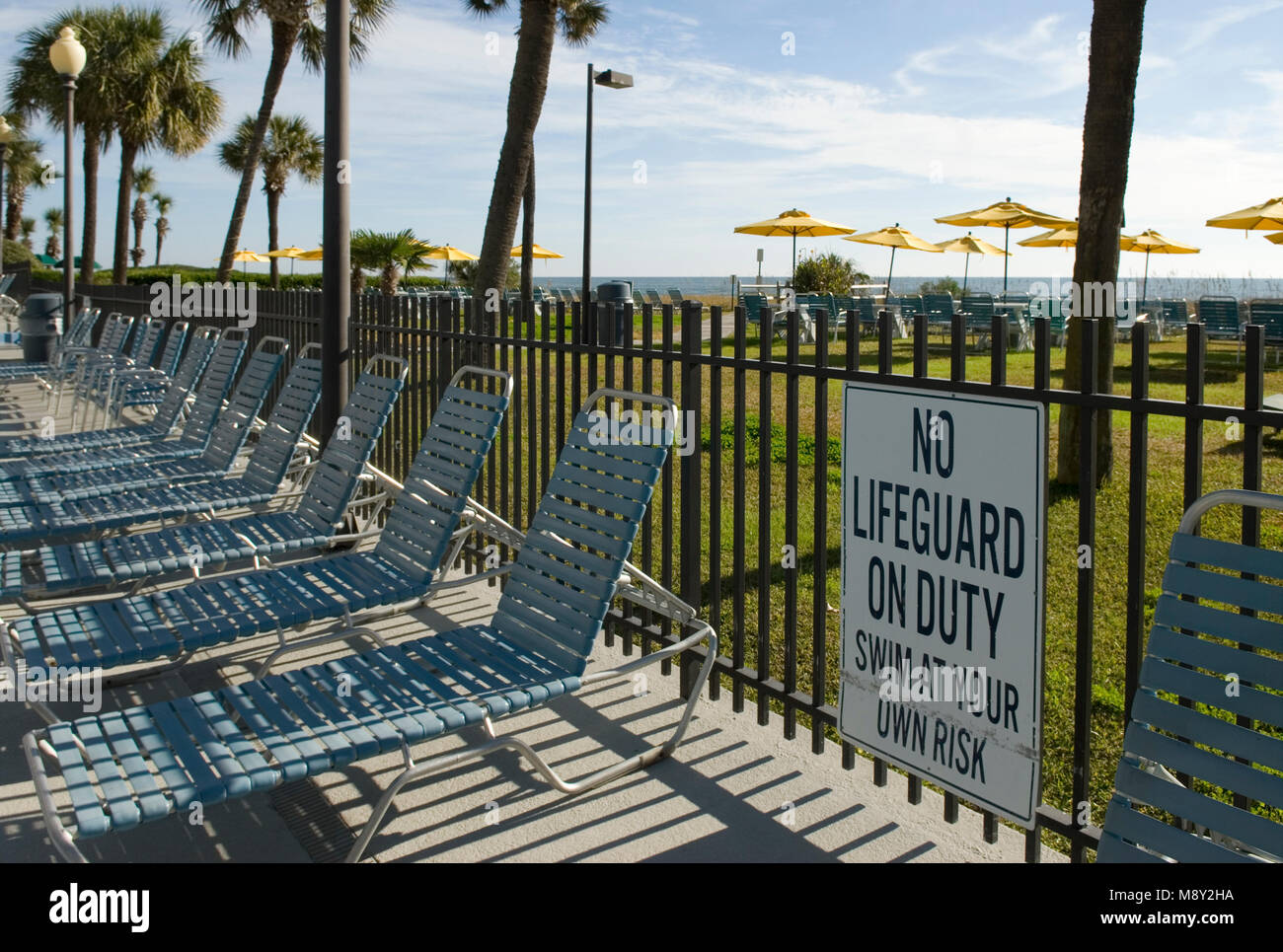No lifeguard swimming pool sign. Stock Photo