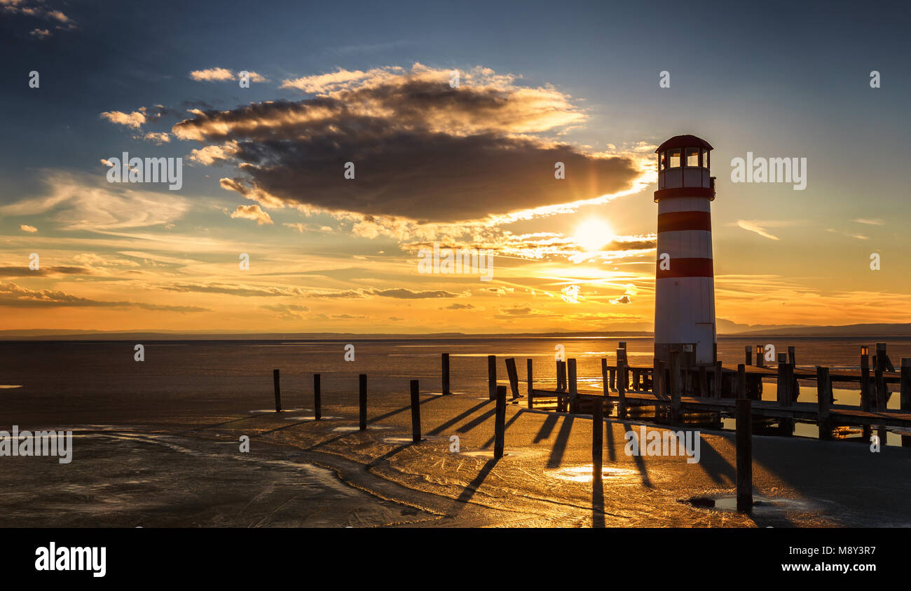 Lighthouse view during winter and dramatic sunset, Podersdorf am see, Austria Stock Photo