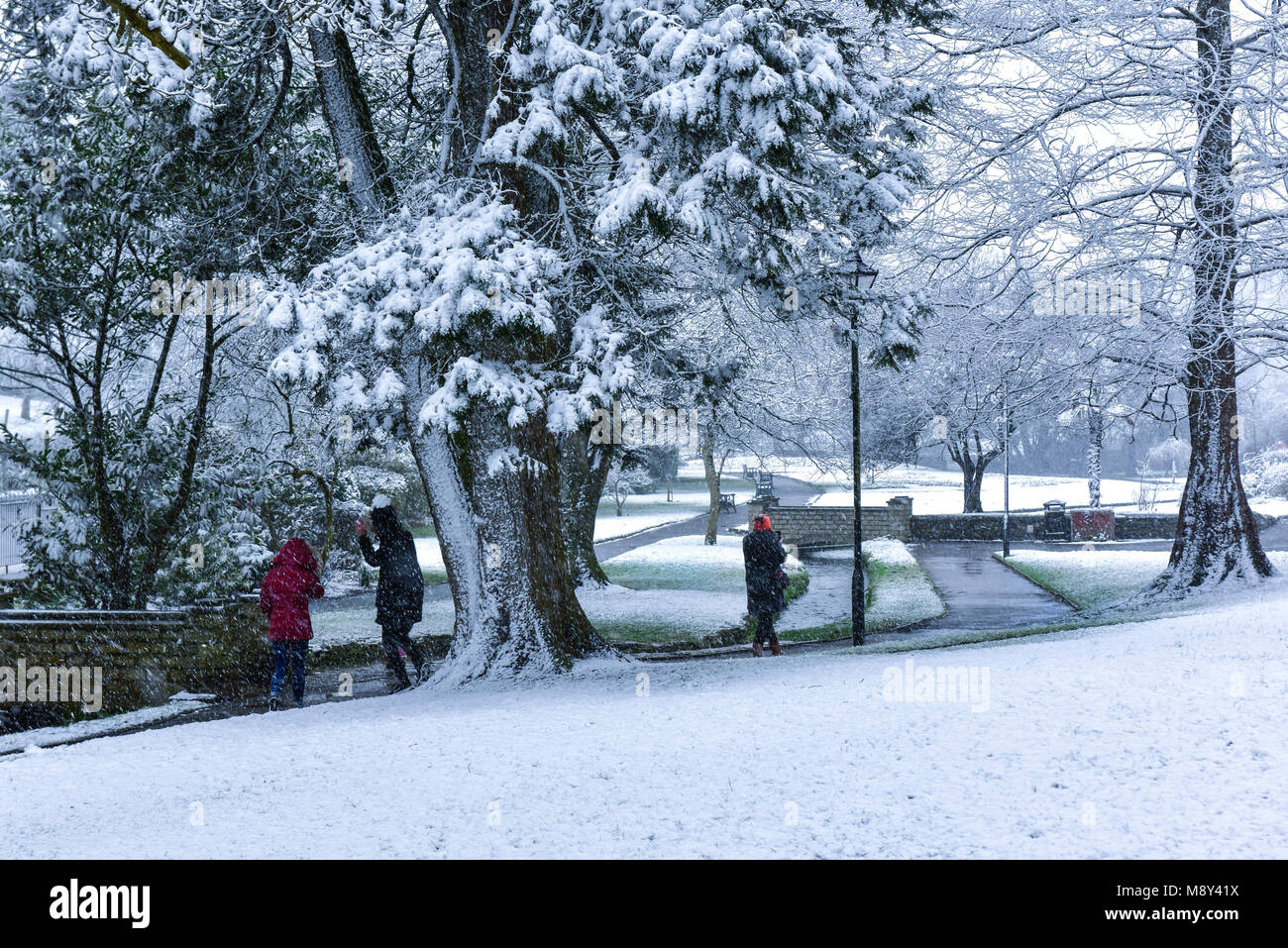 People enjoying the heavy snow fall on Trenance Gardens in Newquay