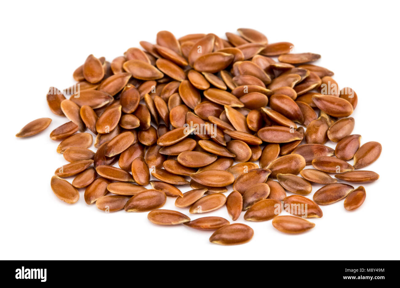 Close up of flax seeds isolated on white background Stock Photo - Alamy