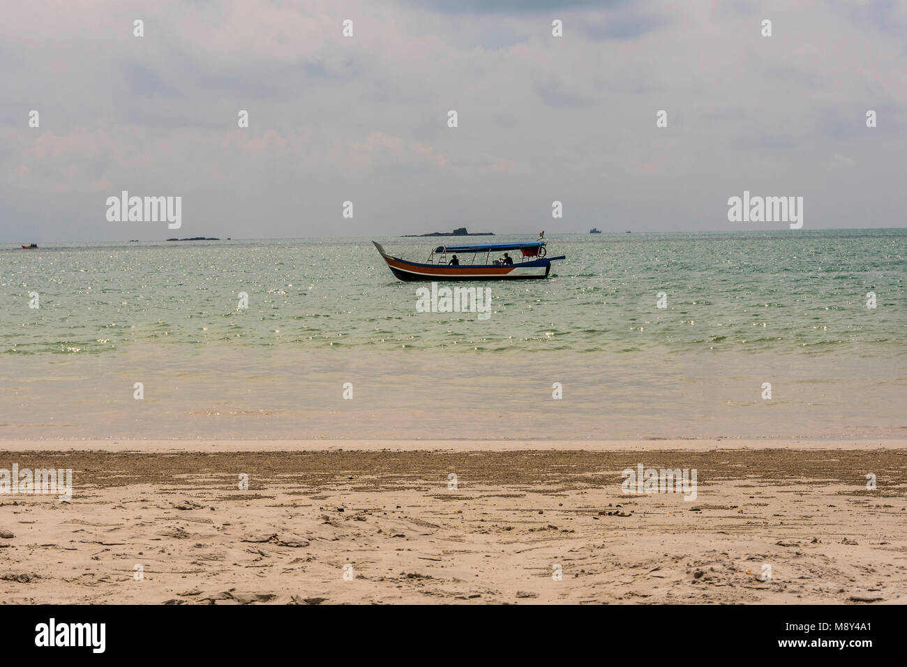 The beach of Cenang on the island of Langkawi is adjacent to the town of the same name and is very busy due to its proximity to the port. malaysia Stock Photo