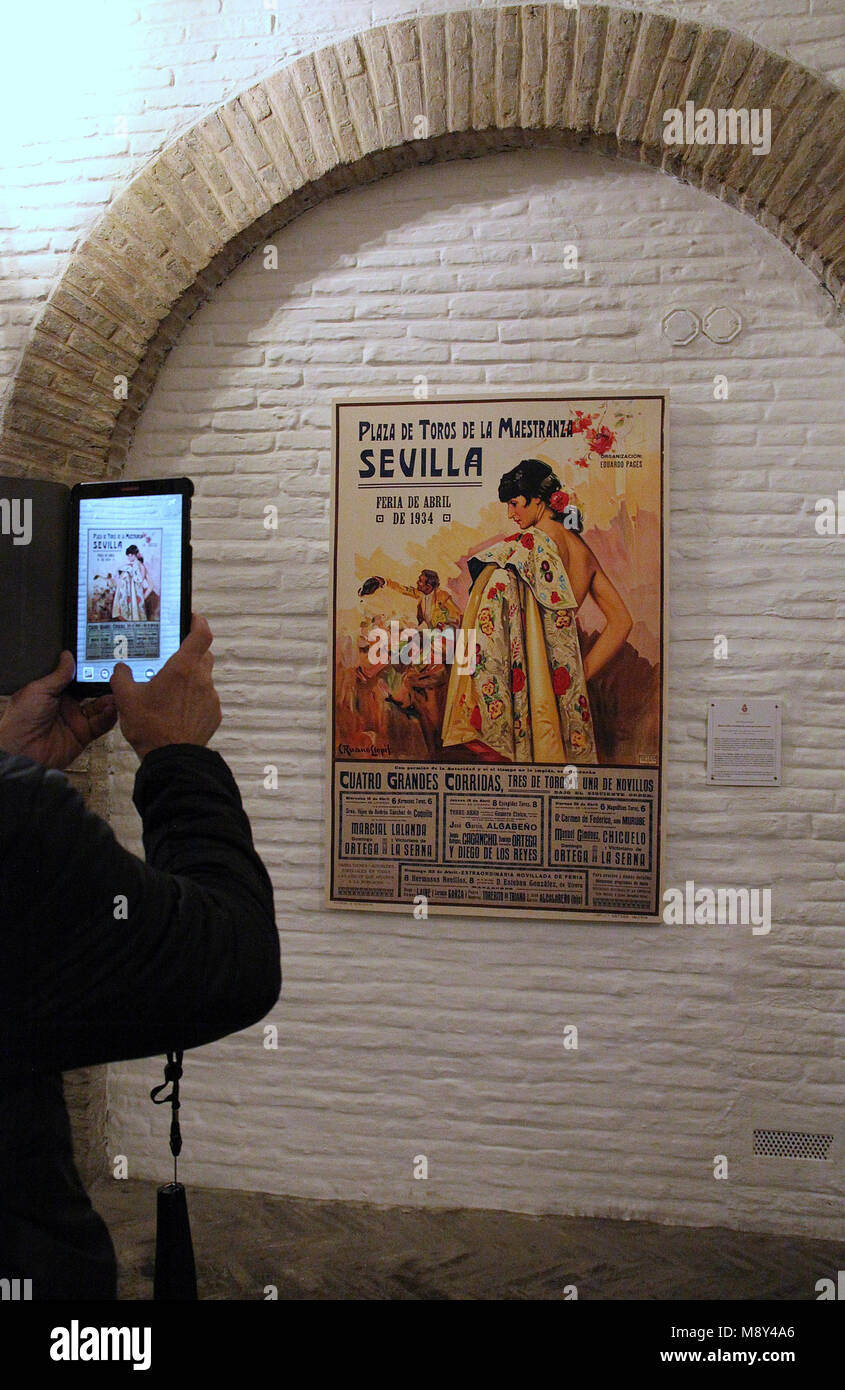 Tourist taking a photo in the museum at Plaza de Toros in Seville Stock Photo
