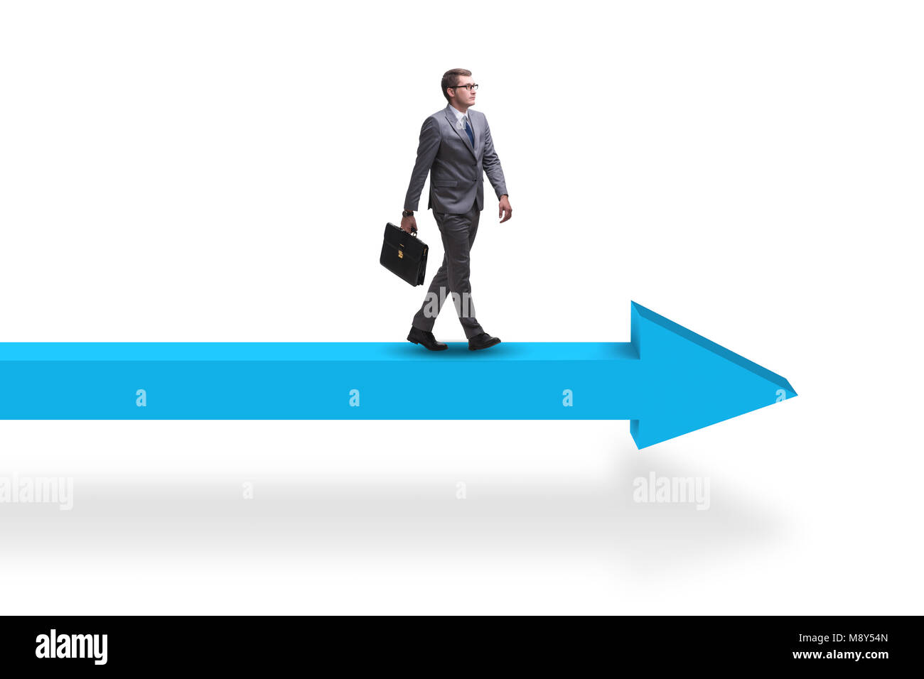 Businessman walking on arrow in business concept Stock Photo - Alamy