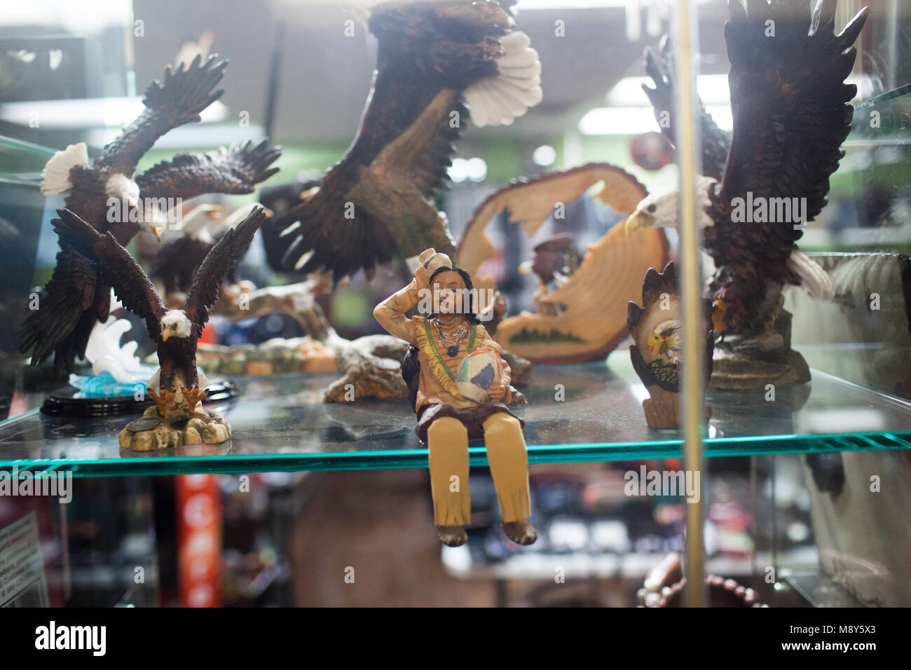 Toy figurines of eagles and an indigenous person in Jackson Square Mall