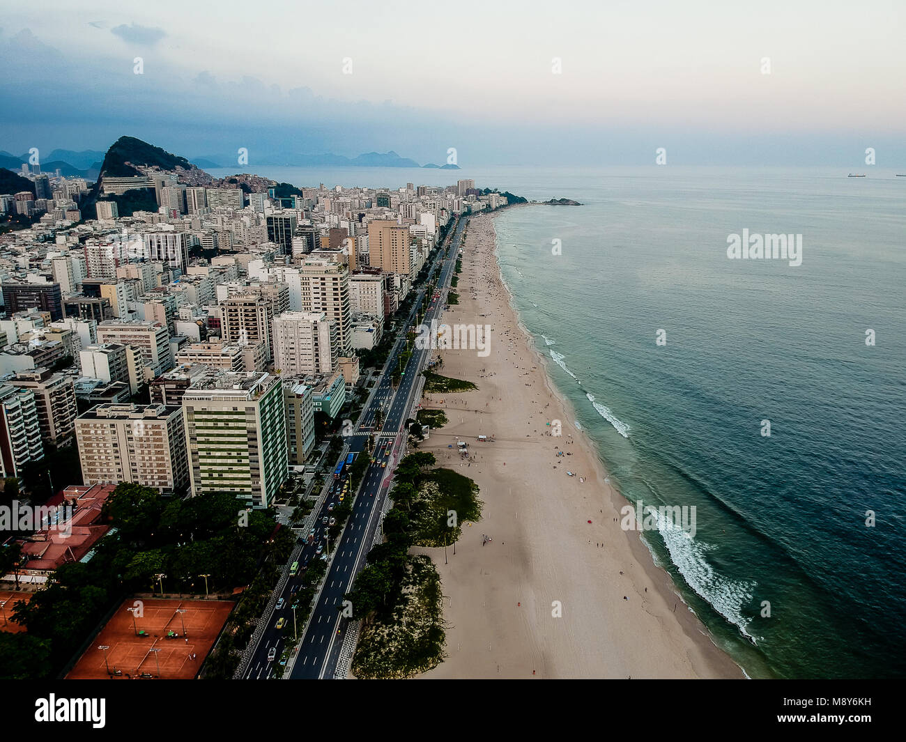 Aerial view of Ipanema beach during sunset, sun with clouds. Rio de Janeiro, Brazil Stock Photo