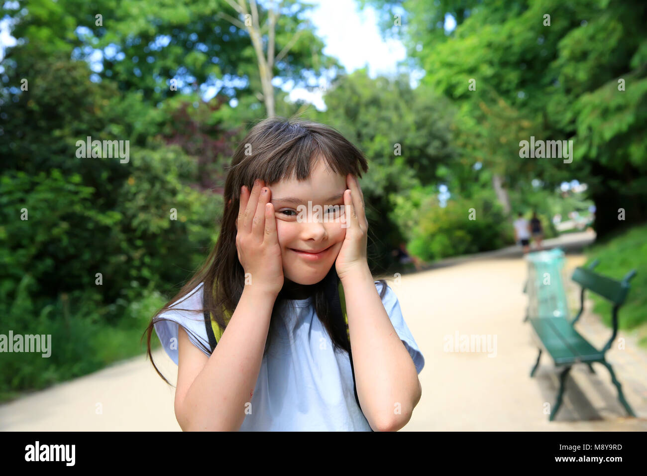 Portrait of little girl smiling in the park Stock Photo - Alamy
