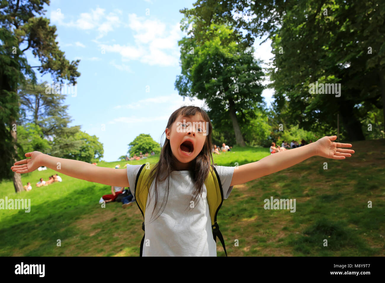 Portrait of little girl smiling outside Stock Photo - Alamy