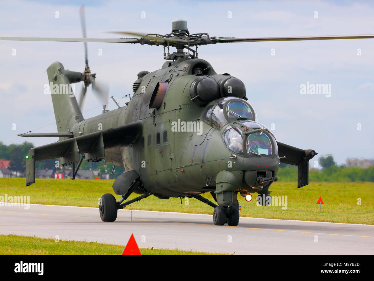 The Polish Air Force Mil Mi-24D Hind-D on runway during International Air Show at the 90th Jubilee of The Polish Air Force Academy. Stock Photo