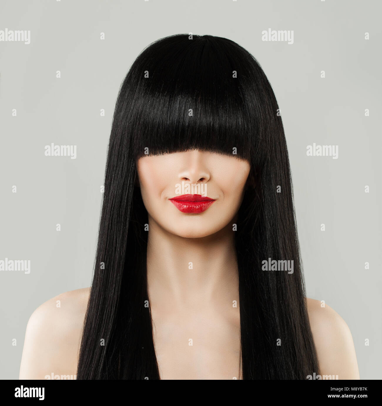 Beautiful Hairstyle Woman Portrait. Model Girl with Long Black Hair and Red Lips Stock Photo