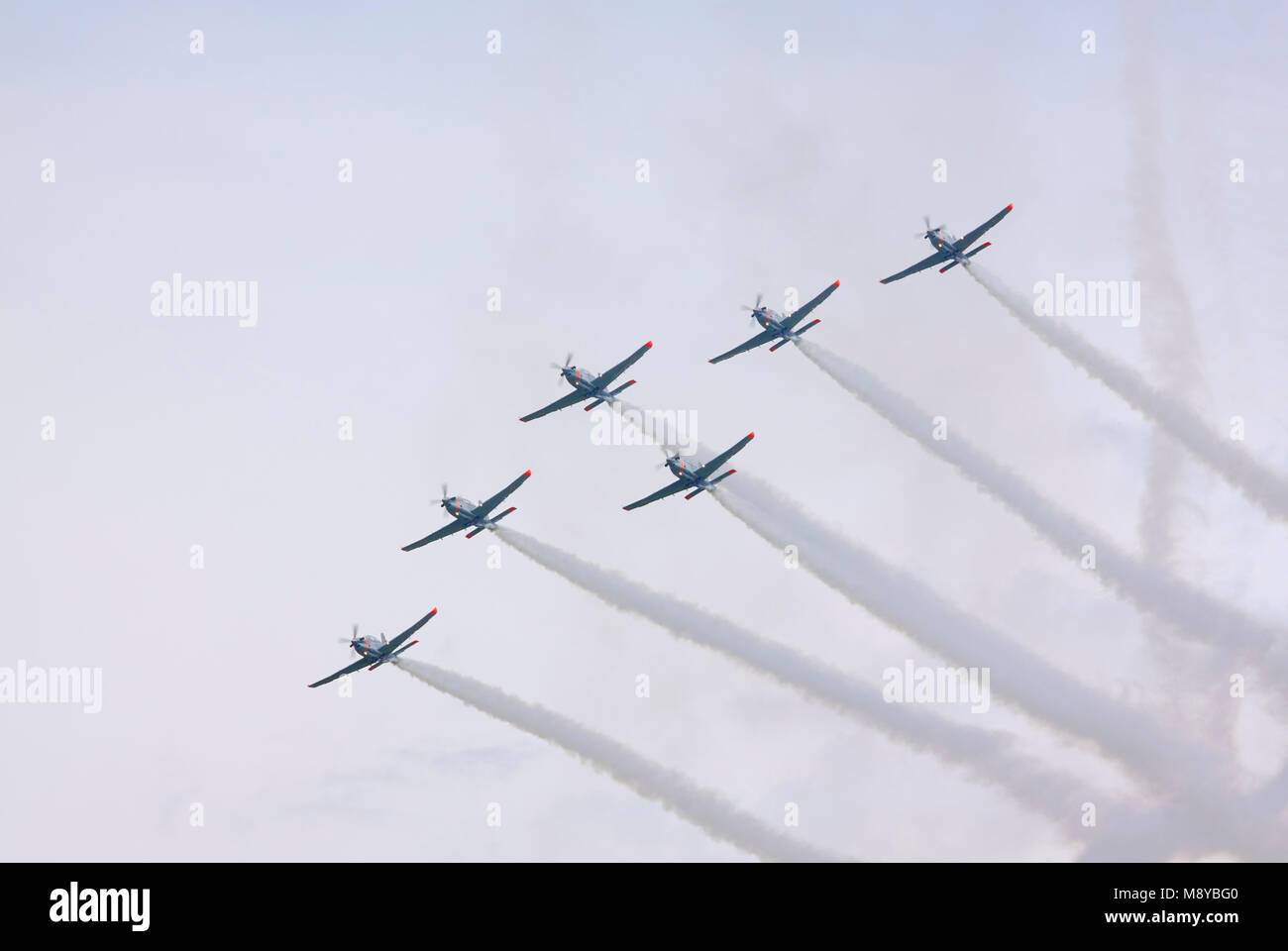 The Polish Air Force Orlik Aerobatics Team Flying Over Sky During International Air Show At The