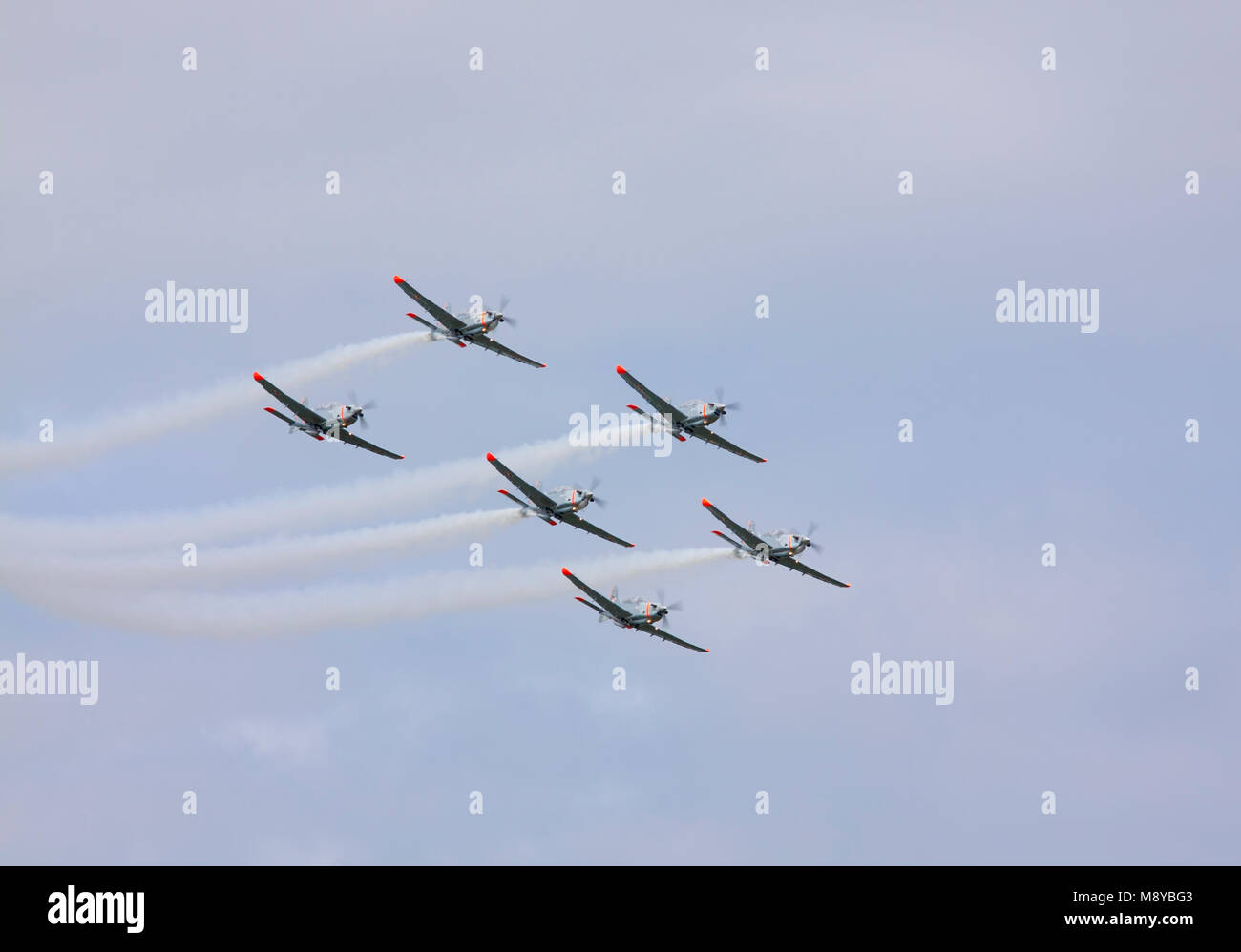 The Polish Air Force Orlik Aerobatics Team flying over sky during International Air Show at the 90th Jubilee of The Polish Air Force Academy. Stock Photo