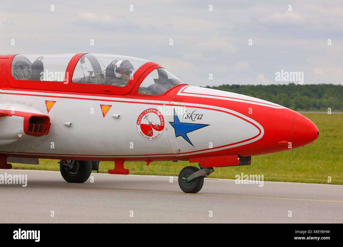 The Polish Air Force TS-11 Iskra MR of White-Red Sparks (Bialo-Czerwone Iskry) aerobatics team on runway during International Air Show. Stock Photo