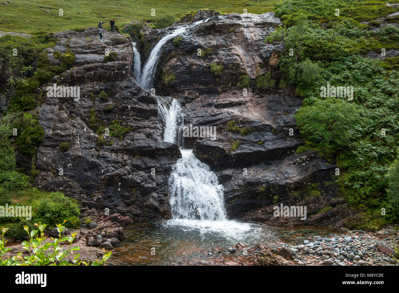 Meeting of the Three Waters waterfall by the A82 road near Glencoe, Highland Region, Scotland, UK Stock Photo