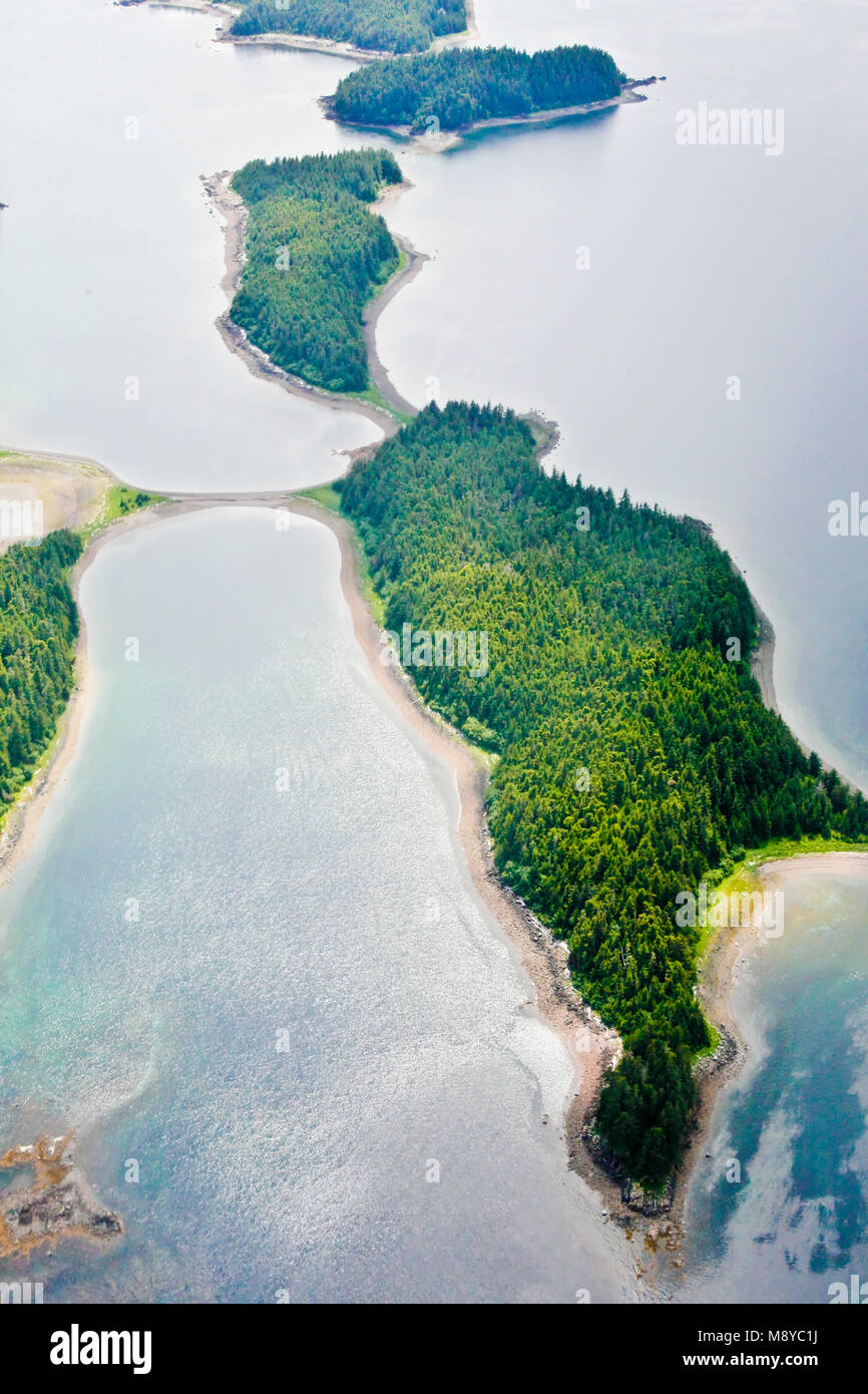 Aerial view of uninhabited areas of Alaska's forested coastline and