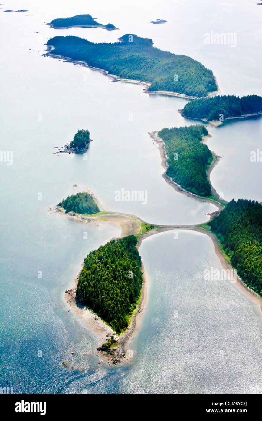 Aerial view of uninhabited areas of Alaska's forested coastline and