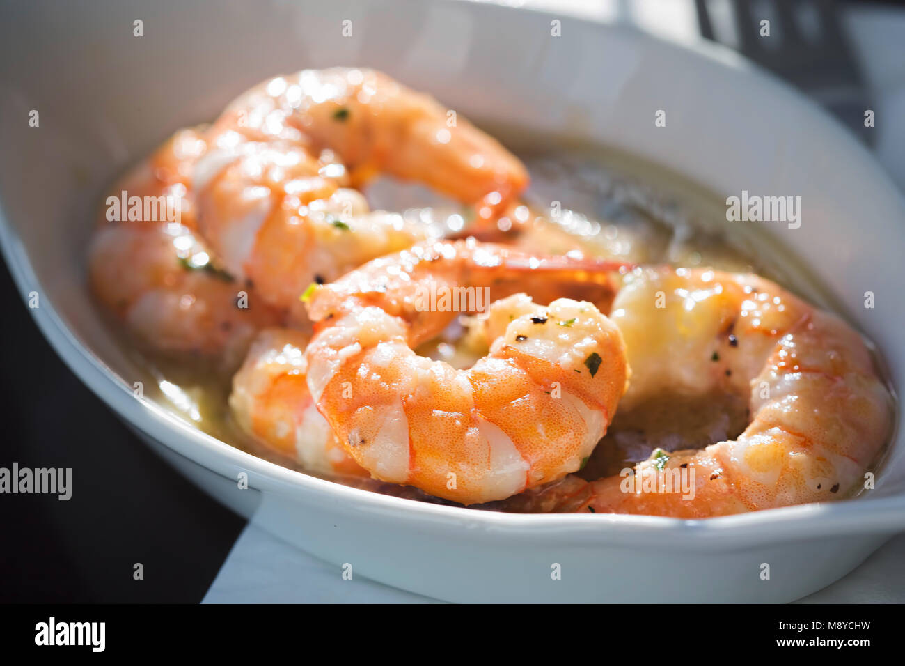 King prawns in white wine sauce Stock Photo Alamy