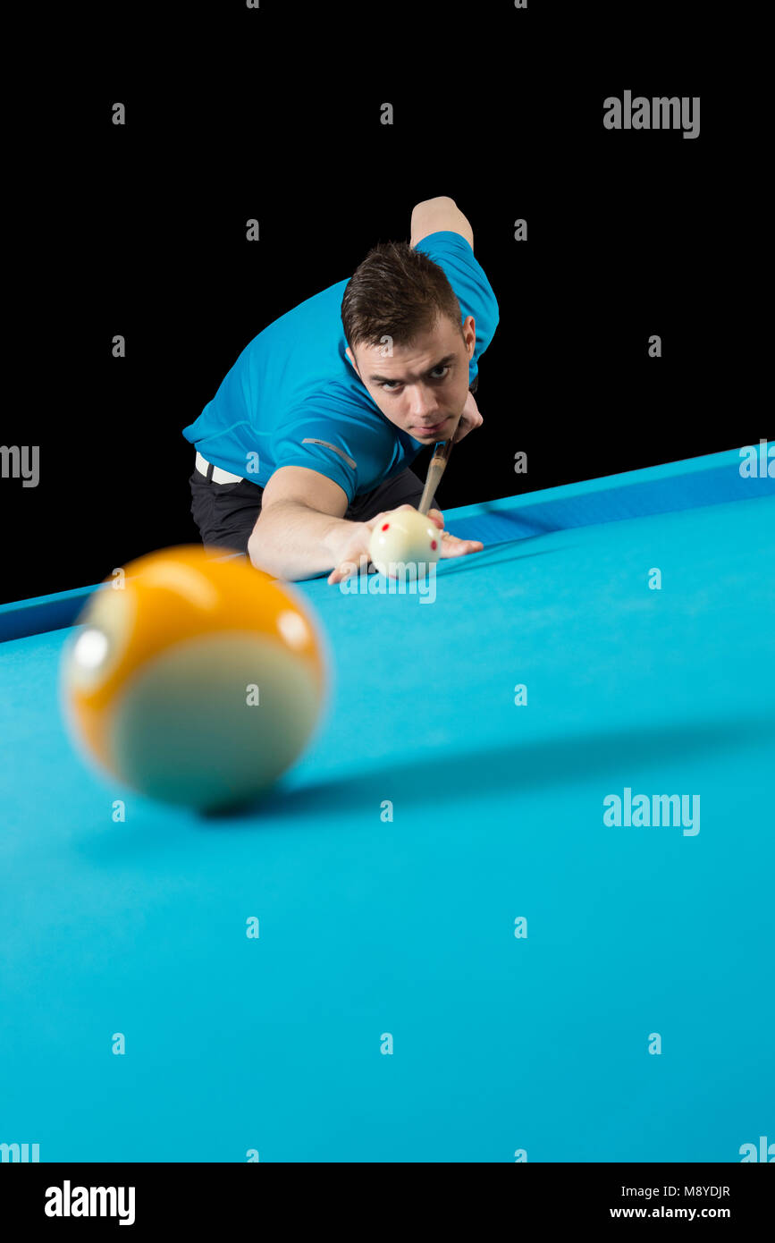 Billiard player hitting the 9 ball Stock Photo Alamy