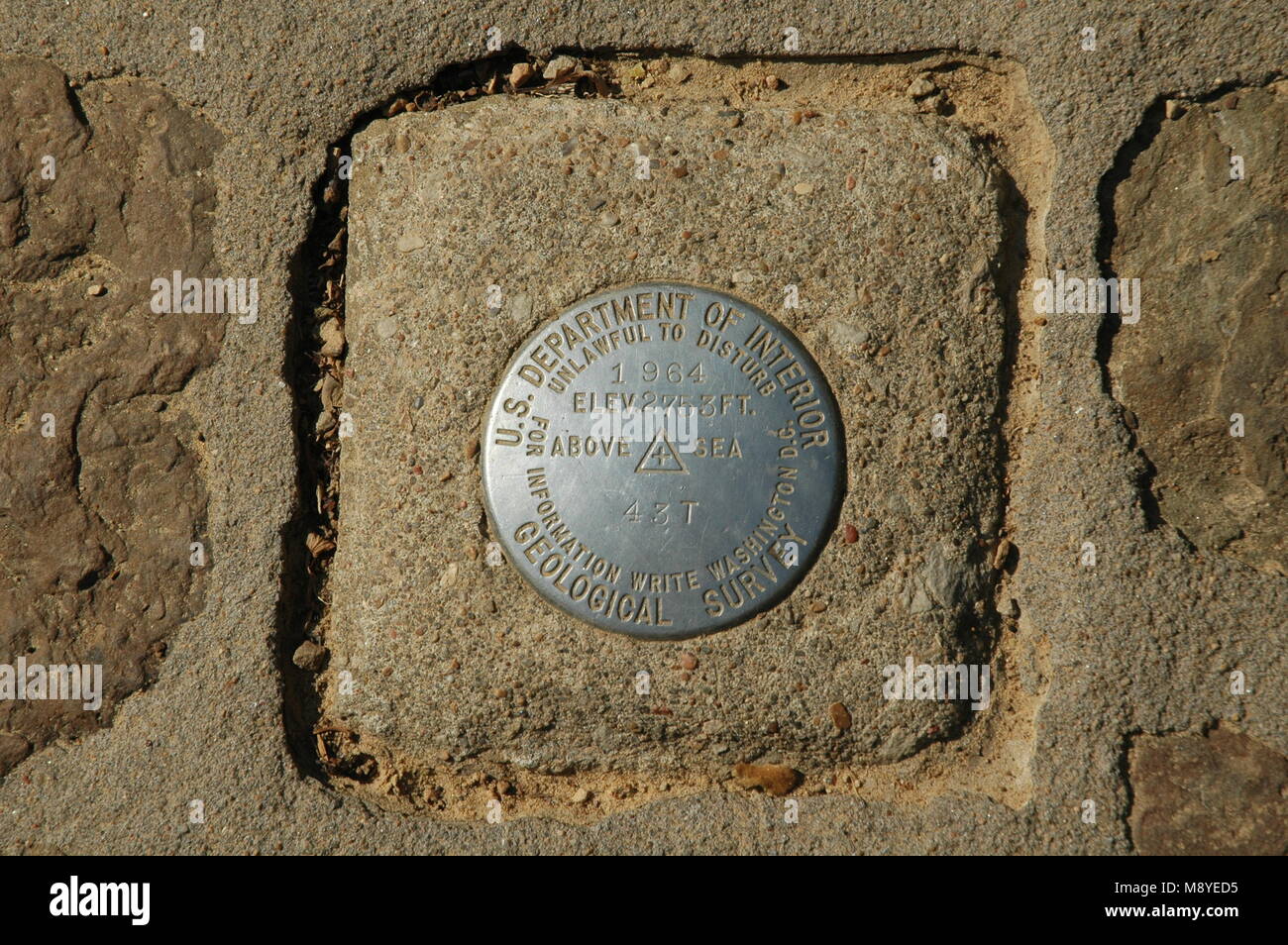 A survey pin marks the top of signal hill, the tallest summer in the Magazine Mountain plateau. Mount Magazine is the highest mountain in Arkansas. Stock Photo