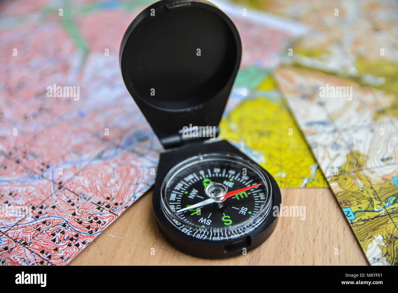 Maps and compass. Planning a trip, laying a route Stock Photo Alamy