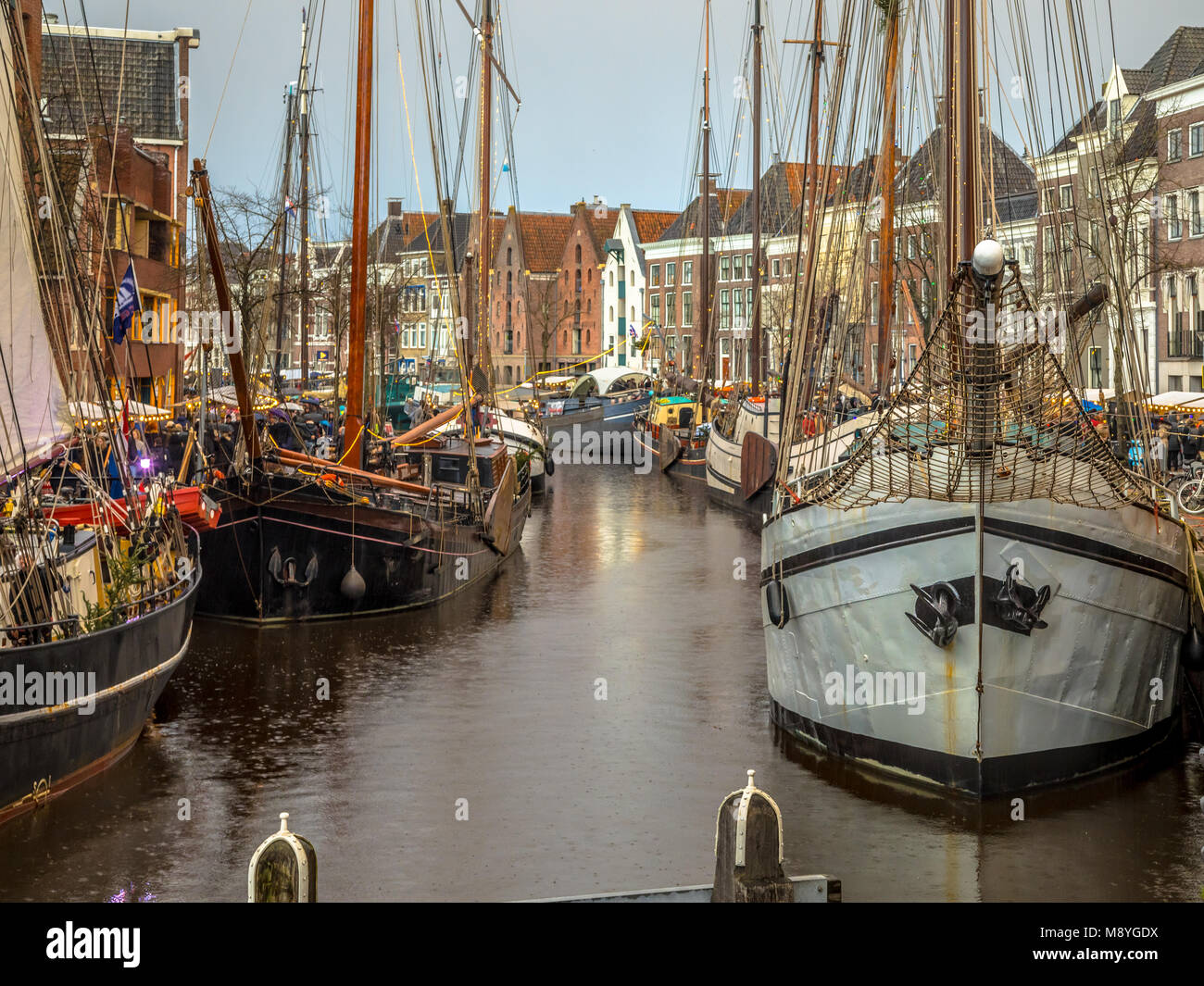 Historic sailing ships at the annual winterwelvaart festival around christmas. reliving the old times on the old quays of Hoge der Aa in Groningen cit Stock Photo