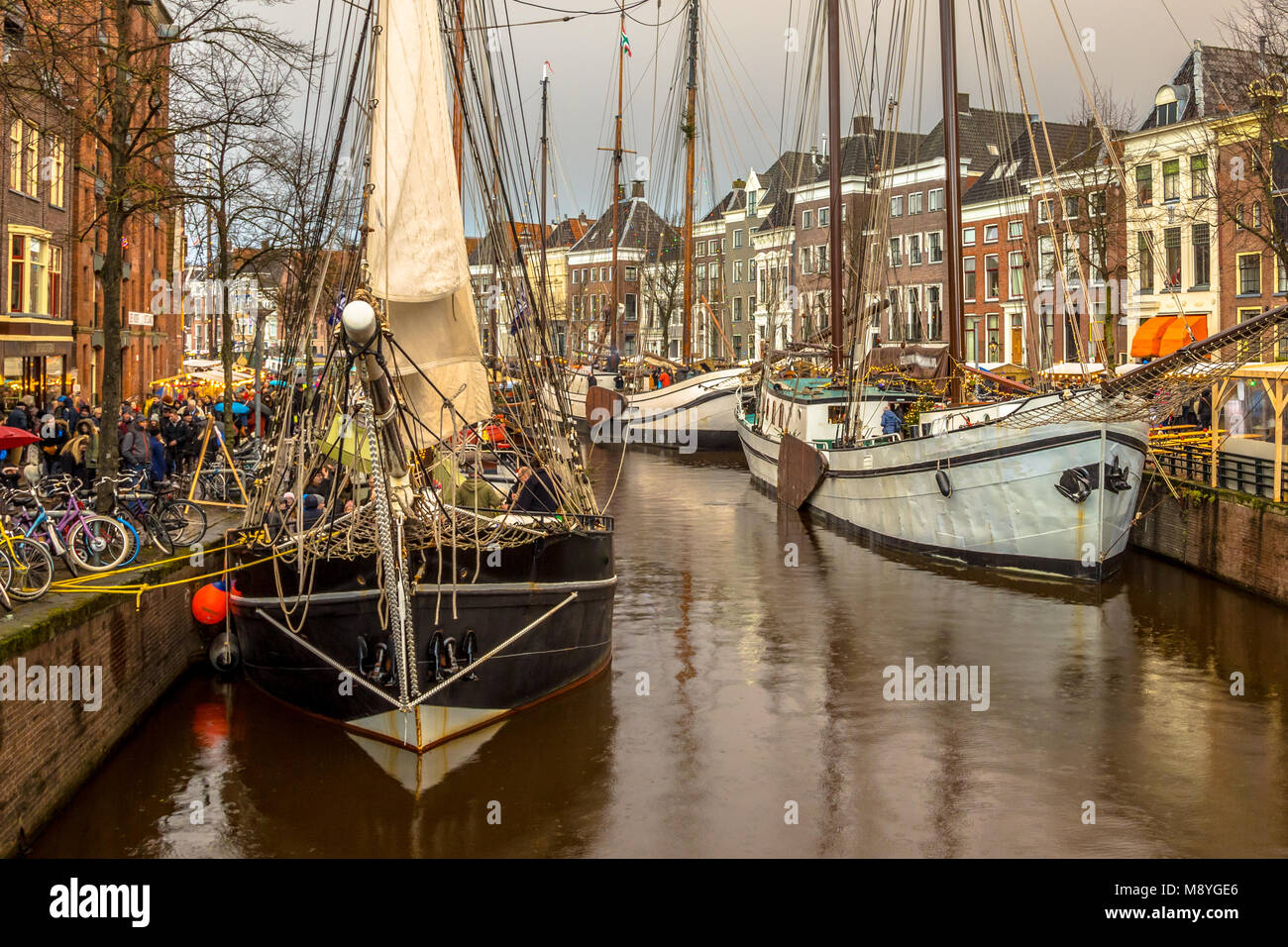 Historic sailing ships at the annual winterwelvaart festival around christmas. reliving the old times on the old quays of Groningen city Stock Photo