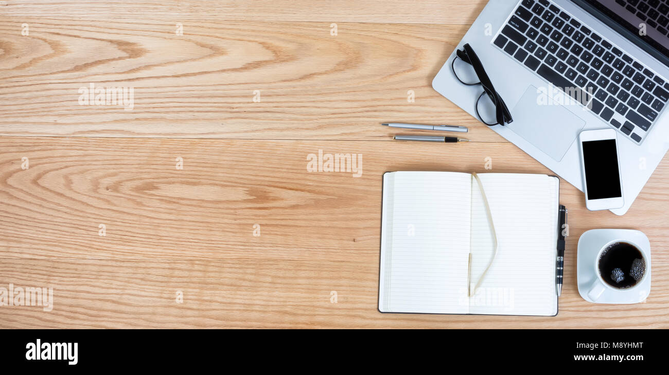 Clean Red Oak Wooden Desktop With Laptop Computer Smart Phone Clean Red Oak Wooden Desktop With Laptop Computer Smart Phone Black Coffee And Writing Materials