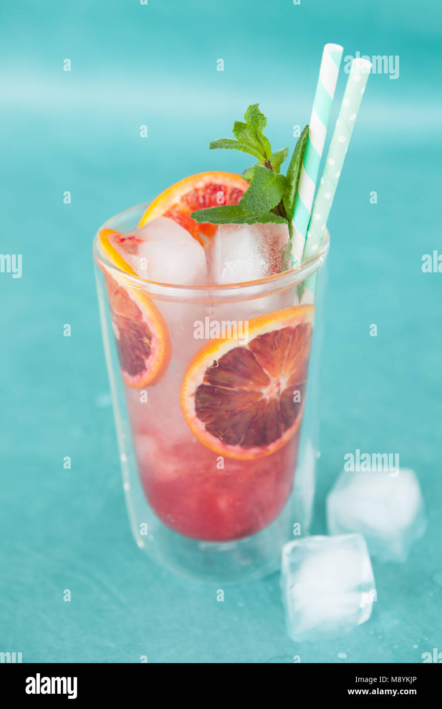 Cold cocktail with fresh bloodoranges and mint leaves Stock Photo - Alamy